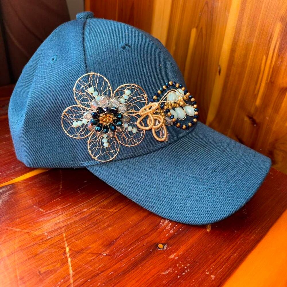 Blue baseball cap with beaded brooch design like new